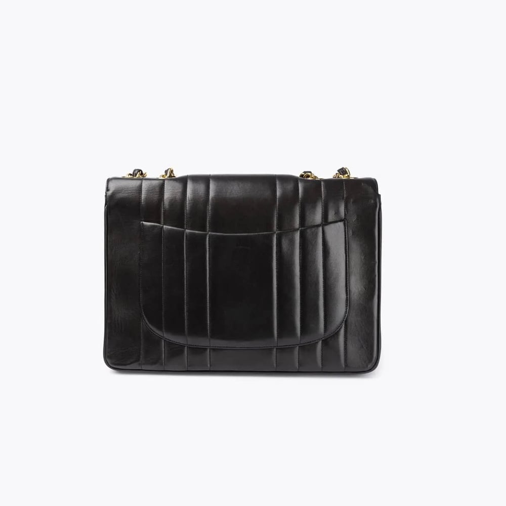 Vintage CHANEL Jumbo Vertical Quilted Single Flap Bag - A Retro Tale