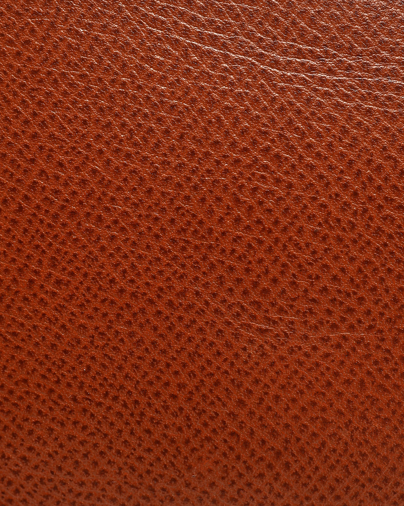 Close-up view of the textured brown Courchevel leather of a vintage Hermès Birkin 30 bag.
