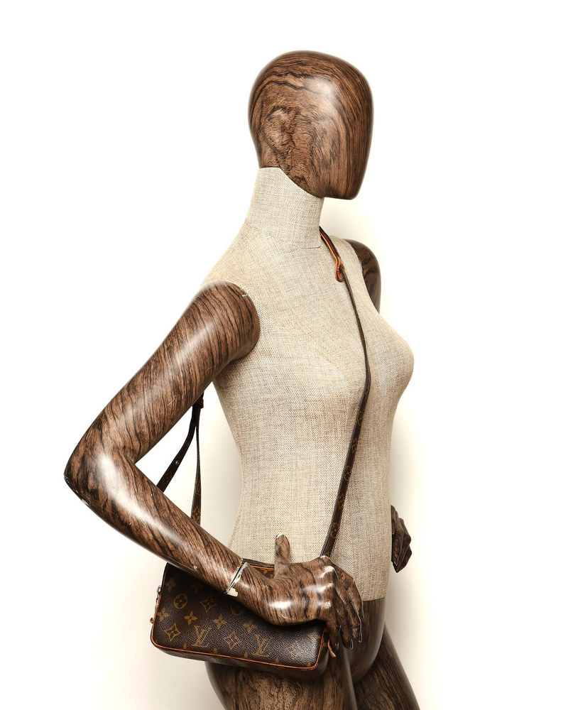 Louis Vuitton Monogram Pochette Marly Bag worn on a mannequin to demonstrate scale.