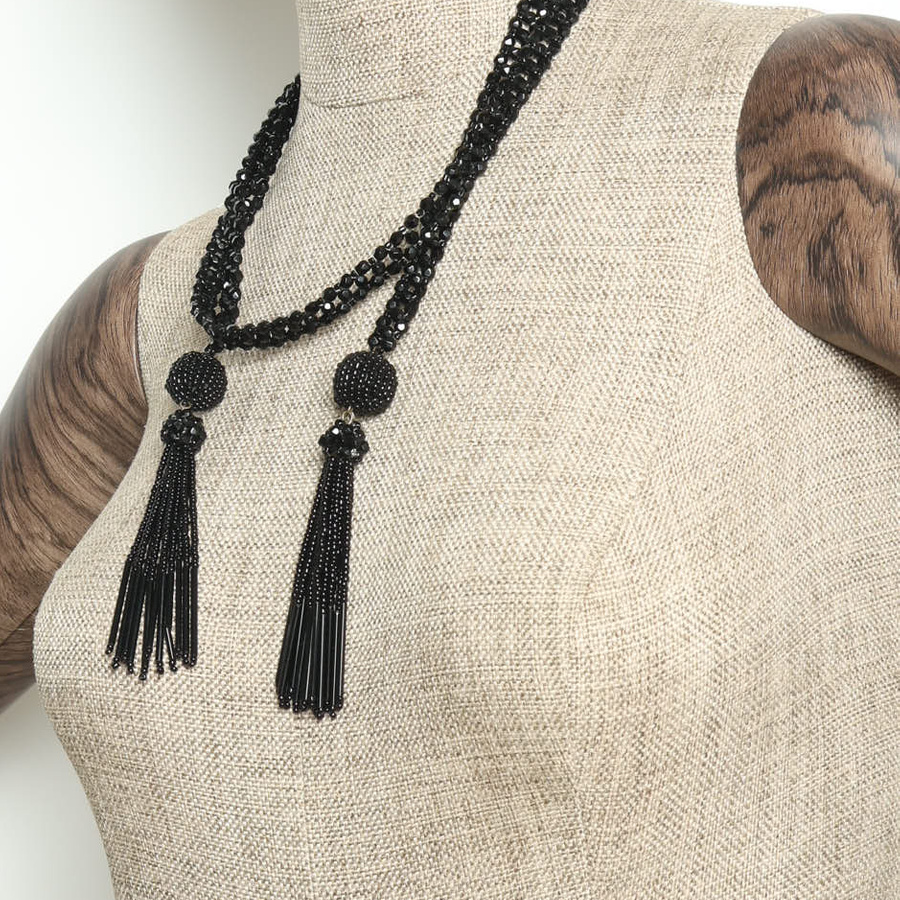 Vintage Bottega Veneta Tassel Necklace in black beads, styled on a mannequin to showcase the lariat design.
