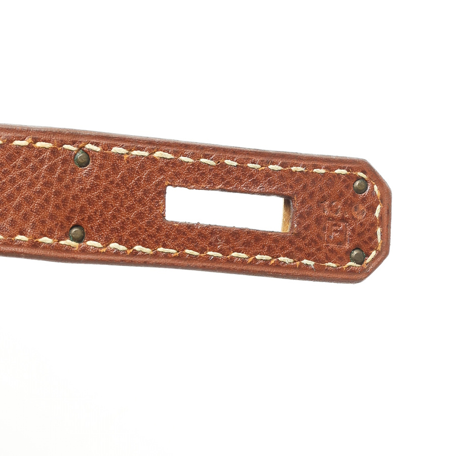 Close-up view of the Square F blind stamp on the brown Courchevel leather strap of the Hermès Birkin 30 bag.