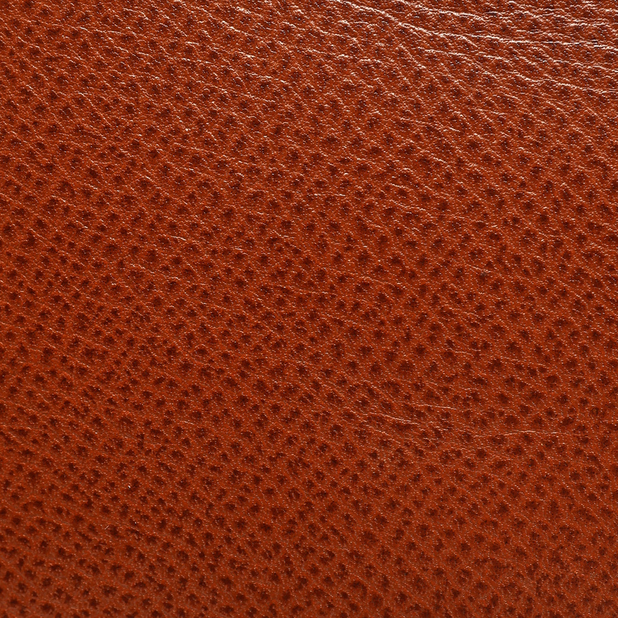 Close-up view of the textured brown Courchevel leather of a vintage Hermès Birkin 30 bag.