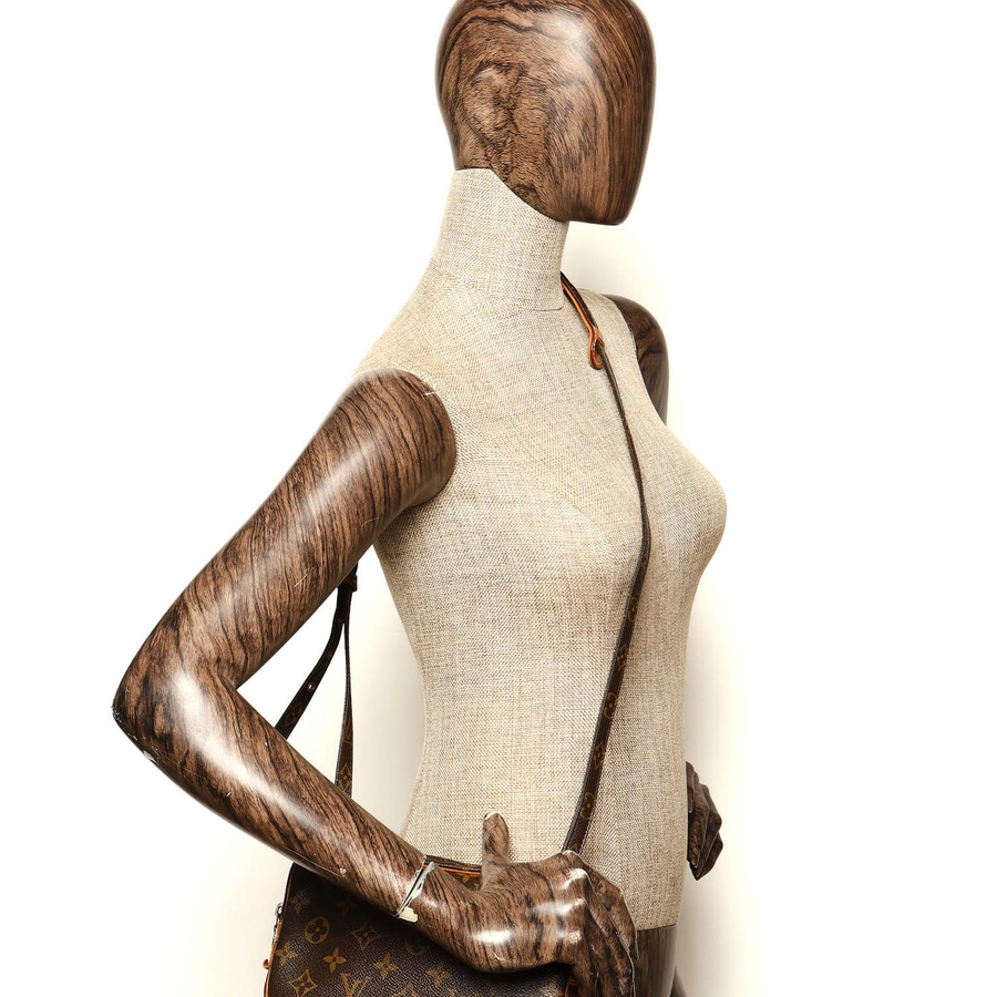 Louis Vuitton Monogram Pochette Marly Bag worn on a mannequin to demonstrate scale.