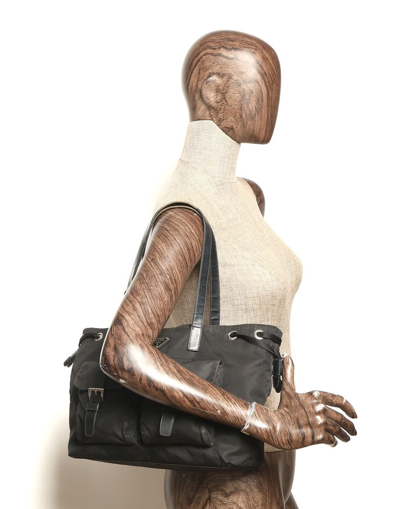 Prada Tessuto Tote Bag worn on a mannequin shoulder