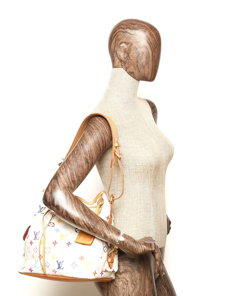 Louis Vuitton Murakami Monogram Petit Noé Bag worn on a mannequin's shoulder.