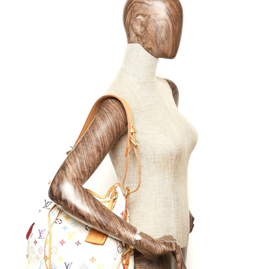Louis Vuitton Murakami Monogram Petit Noé Bag worn on a mannequin's shoulder.