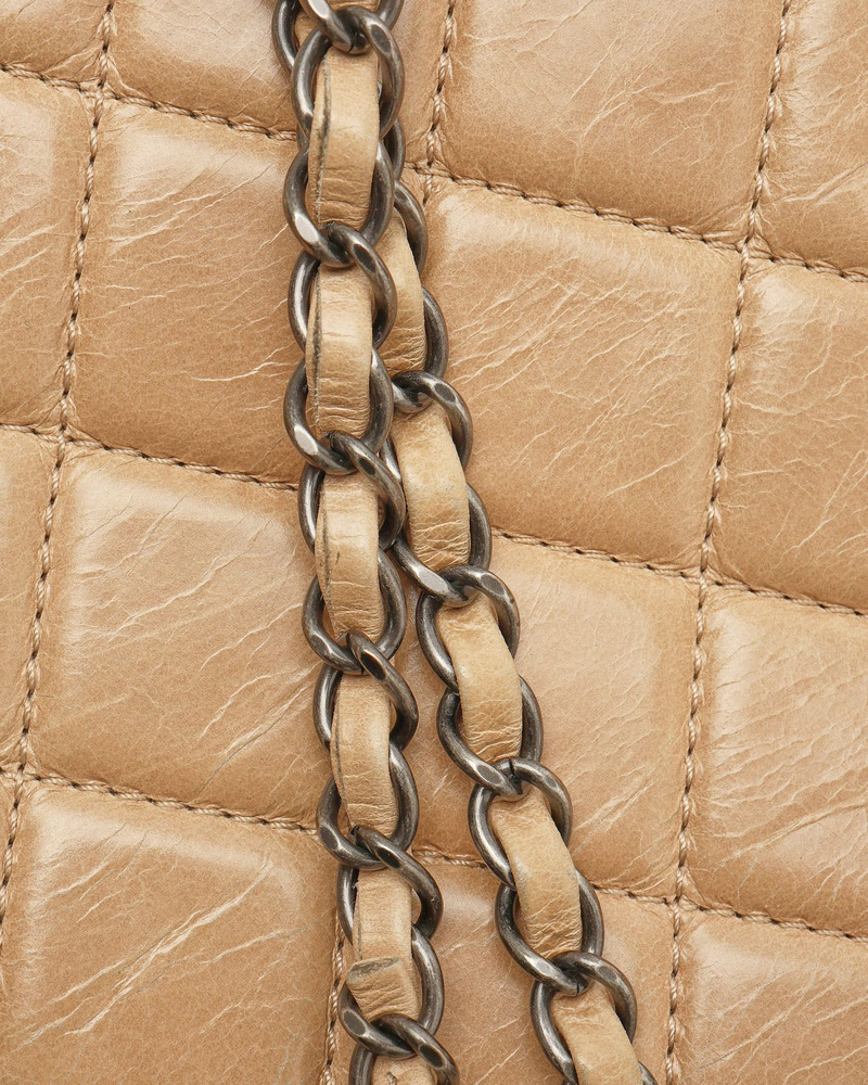 Close-up of the chain strap on a Chanel Large Single Flap Bag